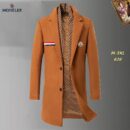 Grey wool-blend Moncler long overcoat with a tricolor detail on the chest pocket, a Moncler logo patch on the lapel, and a striped scarf tucked into the collar.