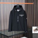 Black Moncler hooded jacket with white logo print on the chest, a utility sleeve pocket, and signature branding.