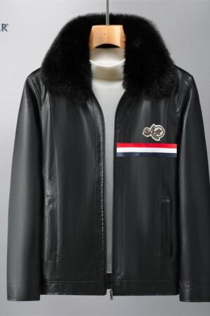 A black faux leather zip-up jacket with a plush black faux fur collar. The chest features a prominent red, white, and blue tri-color stripe below a circular logo patch.