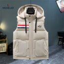 hooded puffer vest with horizontal quilting, featuring a full snap-button front, two zippered pockets, and a rectangular tri-color stripe patch on the left chest.