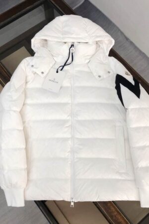 A clean white hooded windbreaker jacket hanging, featuring a full-zip front and a very large black and white outline logo graphic on the left sleeve.