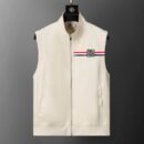 sleeveless zip-up vest with a high collar, featuring a small rectangular patch on the chest with a white, red, and black tri-color stripe and a stylized logo.