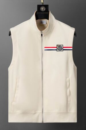sleeveless zip-up vest with a high collar, featuring a small rectangular patch on the chest with a white, red, and black tri-color stripe and a stylized logo.