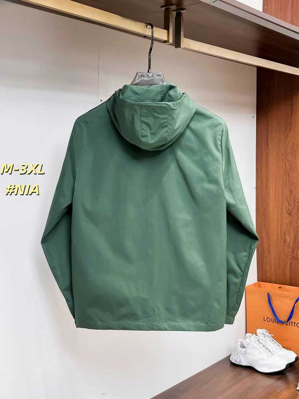 Close-up of the premium sage green performance fabric and the clean, reinforced stitching on the back of a technical shell jacket.